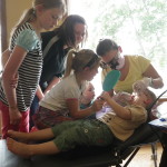 Sisters keep a close eye on their youngest brother